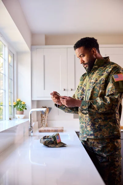 Thoughtful Male American Soldier Uniform Looking Dog Tags Kitchen Home — стоковое фото