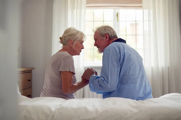 Worried Retired Senior Couple Sitting Bed Home Together — Foto Stock