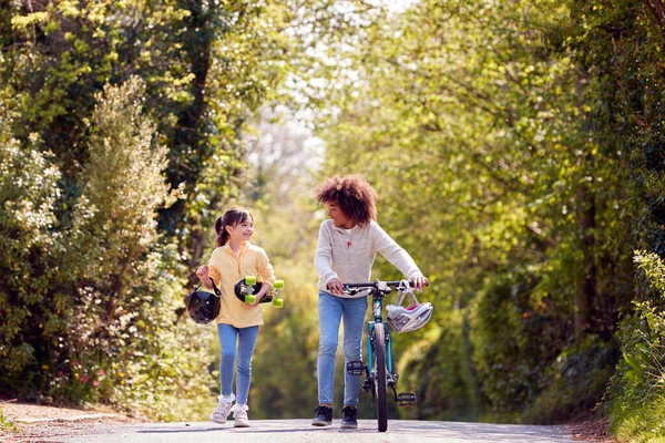 Boy Bike Girl Skateboard Walking Country Road Together — Stockfoto