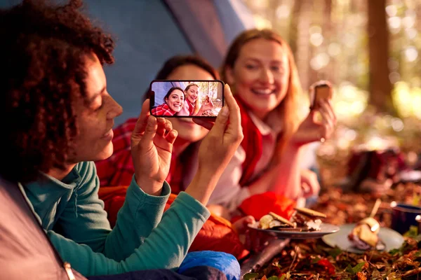 Woman Taking Photo Friends Camping Holiday Forest Lying Tent Eating — ストック写真
