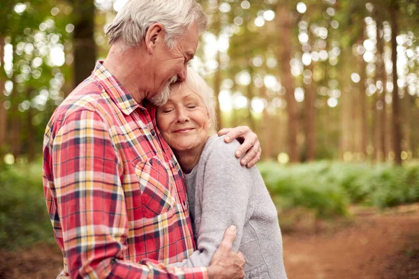 Loving Retired Senior Couple Hugging Walk Woodland Countryside Together —  Fotos de Stock