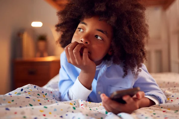 Worried Boy Bedroom Lying Bed Holding Mobile Phone Being Bullied — Φωτογραφία Αρχείου