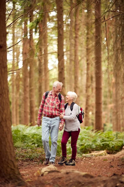Loving Retired Senior Couple Hiking Woodland Countryside Together — Foto de Stock