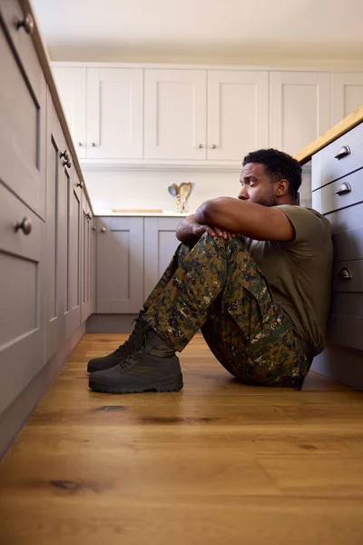 Depressed Male Soldier Uniform Suffering Ptsd Sitting Kitchen Floor Home Images De Stock Libres De Droits