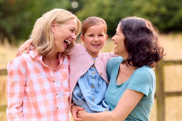 Portrait Same Sex Family Two Loving Mature Mums Hugging Daughter — Stock Photo, Image