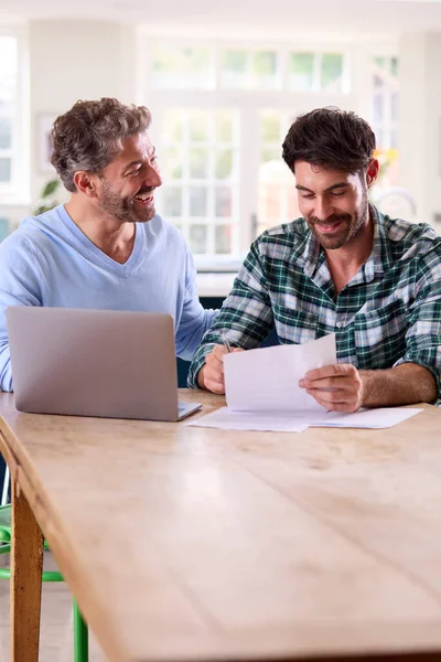 Same Sex Male Couple Using Laptop Home Check Domestic Finances — Stock Photo, Image