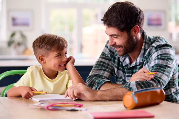 Father Home Kitchen Helping Son Homework — Stock Photo, Image