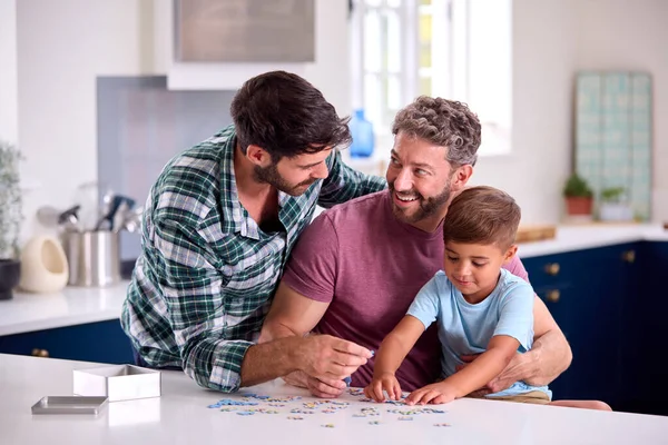 Same Sex Family Two Dads Son Doing Jigsaw Puzzle Kitchen — Stock Photo, Image
