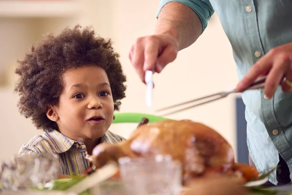 Grandson Watching Grandfather Carve Turkey Family Celebrate Thanksgiving Meal Home — Stock Photo, Image