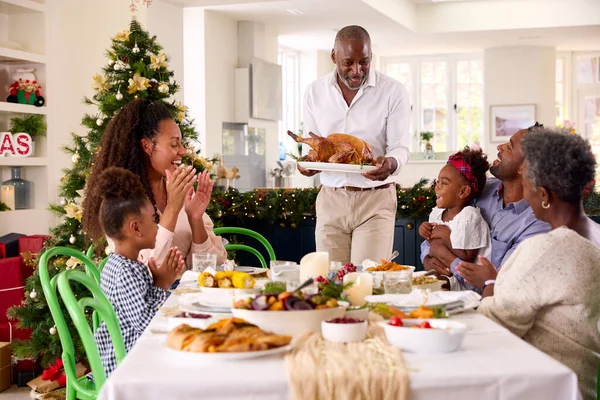 Multi Generation Family Celebrating Christmas Home Grandfather Serving Turkey — Stock Photo, Image