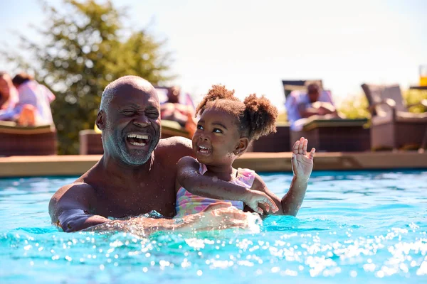 Grandfather Teaching Granddaughter Swim Outdoor Pool Holiday — Stock Photo, Image