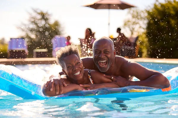 Portrait Smiling Senior Couple Summer Holiday Relaxing Swimming Pool Inflatable — Stock Photo, Image