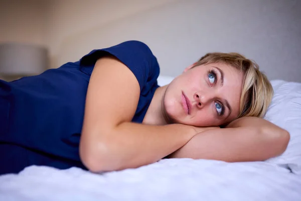 Thoughtful Woman Wearing Medical Scrubs Lying Bed Home — Stock Photo, Image