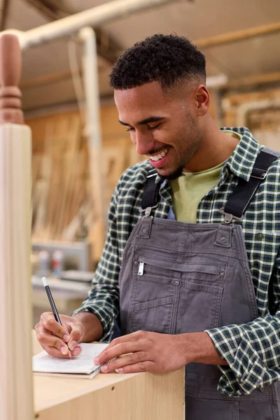 Male Apprentice Working Carpenter Furniture Workshop Making Notes — Stock Photo, Image