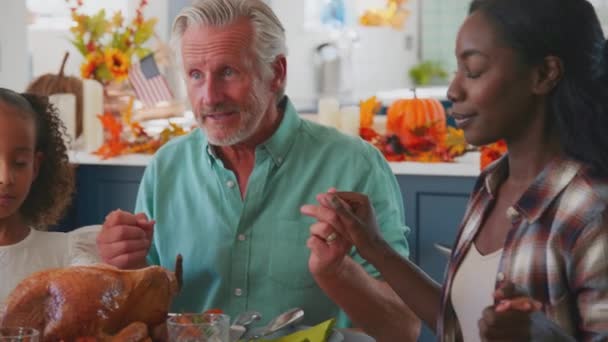 Multi Generation Family Joining Hands Say Prayer Enjoying Thanksgiving Meal — Stock Video