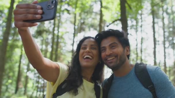 Couple Hiking Summer Woodland Countryside Taking Selfie Mobile Phone Shot — Stock Video