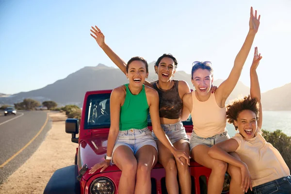 Portrait Laughing Female Friends Sitting Hood Open Top Car Road — Stock Photo, Image