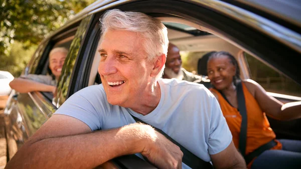 Group Senior Friends Enjoying Day Trip Out Driving Car Together — Stock Photo, Image