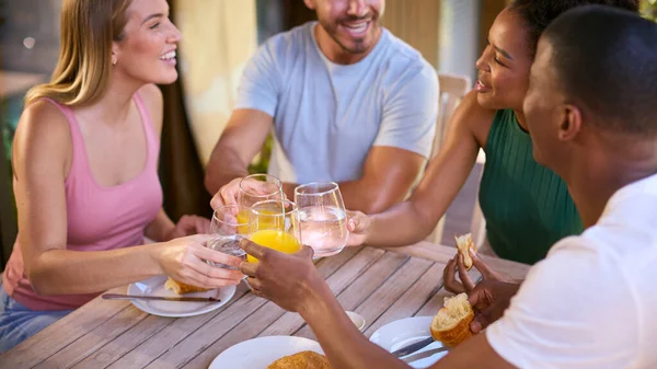 Group Smiling Multi Cultural Friends Eating Breakfast Outdoors Home Making — Stok Foto