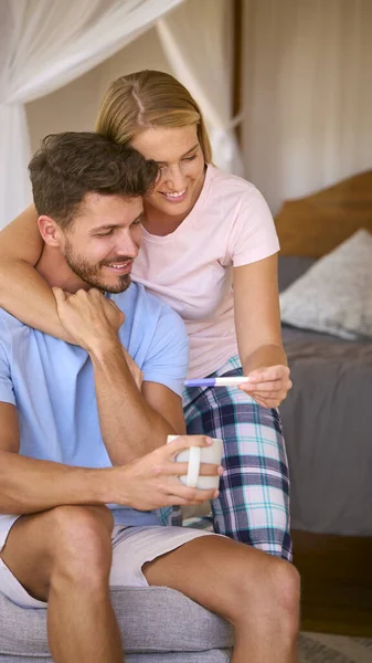 Excited Couple Bedroom Home Celebrating Positive Pregnancy Test Result — Stock Photo, Image