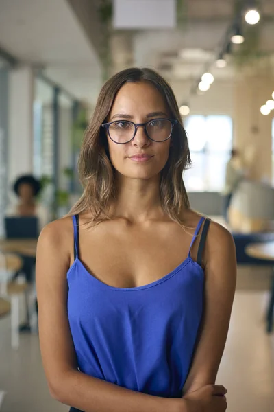 Portrait Smiling Young Businesswoman Wearing Glasses Standing Busy Office — Stock Photo, Image