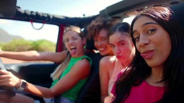 Portrait Female Friends Pulling Faces Open Top Car Laughing Road — Stock Video