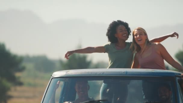 Two Women Standing Back Pick Truck Waving Friends Enjoy Road — Stock Video