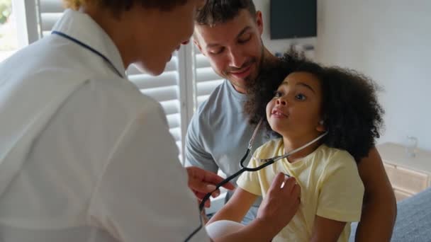 Female Nurse Wearing Uniform Gives Girl Patient Stethoscope She Can — Stock Video