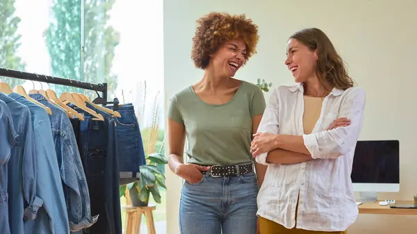Two Laughing Women Friends Running Online Fashion Business Home Together — Stock Photo, Image