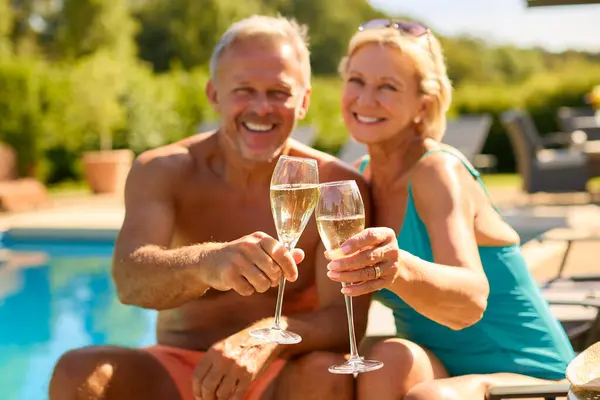 Portrait Senior Couple Holiday Swimming Costumes Drinking Champagne Hotel Swimming — Stock Photo, Image