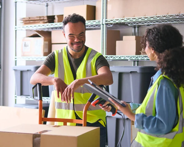 Woman Using Digital Tablet Male Colleague Syndrome Working Warehouse — Stock Photo, Image
