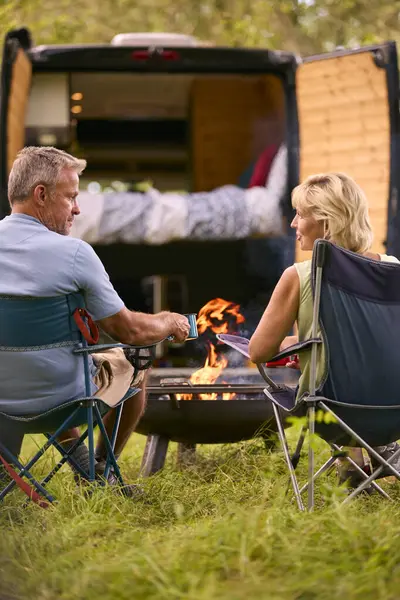 Rear View Senior Couple Camping Countryside Drinking Coffee Outdoor Fire — Stock Photo, Image