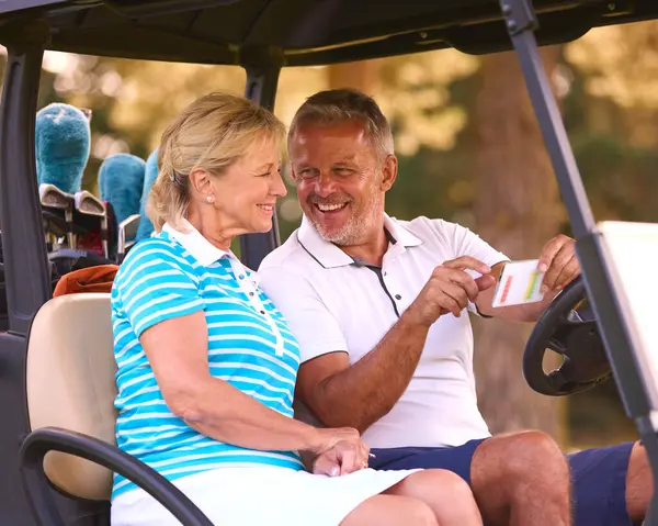 Senior Couple Sitting Buggy Golf Course Marking Score Card Together — Stock Photo, Image