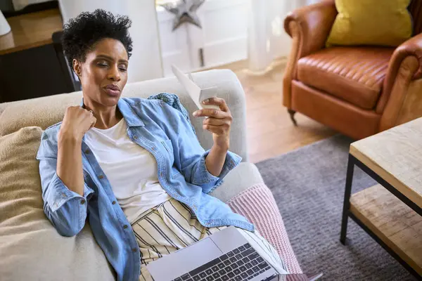 stock image Menopausal Mature Woman At Home With Laptop Having Hot Flush Fanning Herself