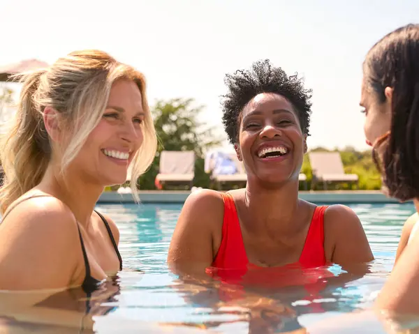 Three Mature Female Friends Wearing Swimsuits Outdoor Pool Spa Day — Stock Photo, Image