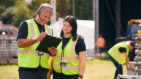 Male Female Production Team Headsets Setting Outdoor Stage Music Festival — Stock Photo, Image