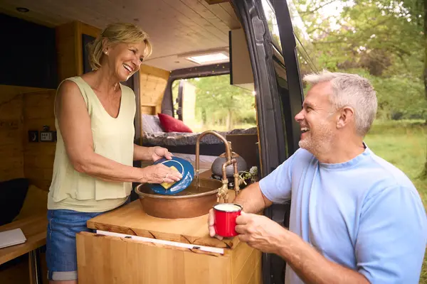 Senior Couple Enjoying Camping Countryside Relaxing Doing Chores Together — Stock Photo, Image