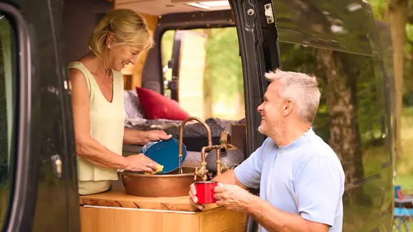 Senior Couple Enjoying Camping Countryside Relaxing Doing Chores Together — Stock Photo, Image