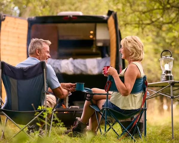 Rear View Senior Couple Camping Countryside Drinking Coffee Outdoor Fire — Stock Photo, Image