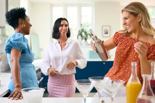Three Mature Female Friends Home Having Fun Mixing Cocktails Together — Stock Photo, Image