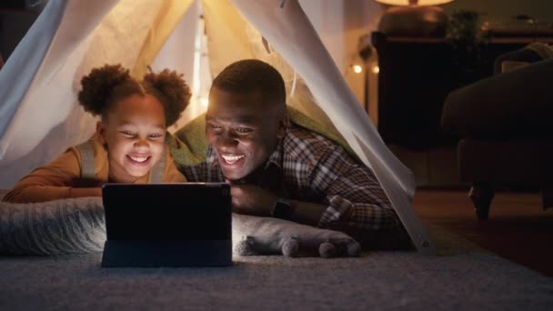 Father Daughter Home Lying Indoor Tent Camp Watching Streaming Digital — Stock Video