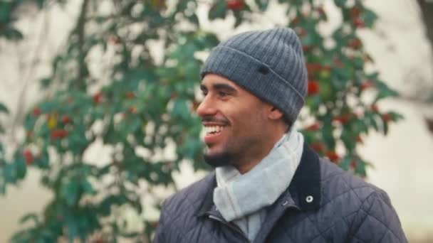 Portrait Smiling Young Man Wearing Woollen Beanie Hat Scarf Cold — Stock Video