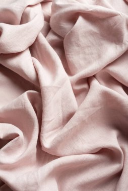 Terzi dükkânı konsepti: açık pembe keten kumaş