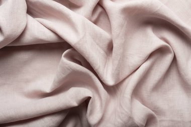 Terzi dükkânı konsepti: açık pembe keten kumaş