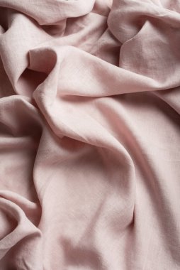 Terzi dükkânı konsepti: açık pembe keten kumaş