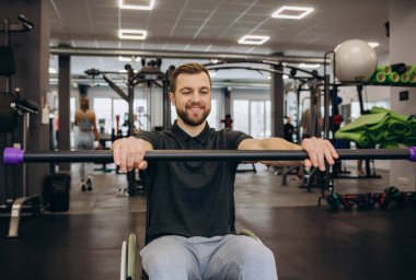 Person who uses a wheelchair training in the gym. Rehabilitation center