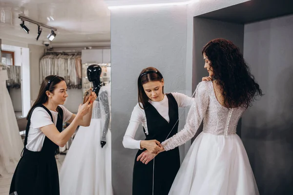 Female Making Adjustment Wedding Gown Fashion Designer Studio Bride Wearing — стокове фото
