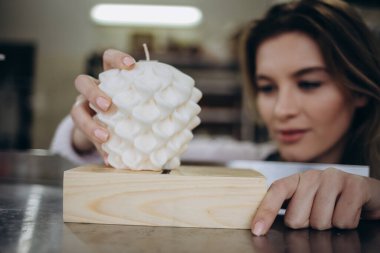 Creative occupation of candle making. woman making candles from soy wax, working in her creative space, preparing to make candles.