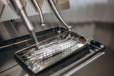 Close-up of a dentist's chair, with all the instruments ready to do a check-up. dental health