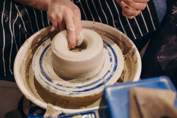 Master class on modeling of clay on a potter\'s wheel In the pottery workshop